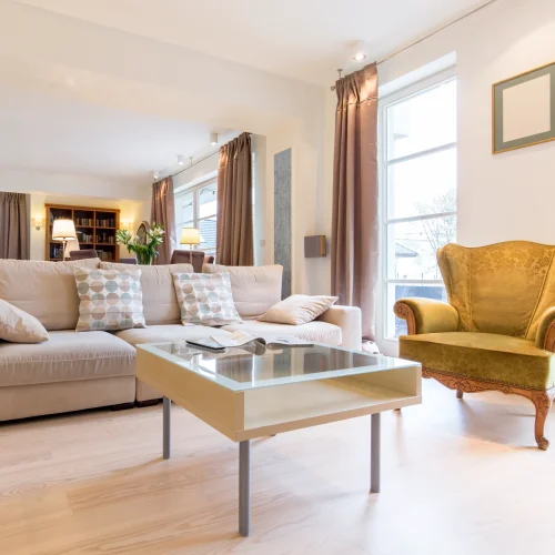 living-room-interior-with-beige-couch-and-armchair-2026-03-10-03-13-05-utc